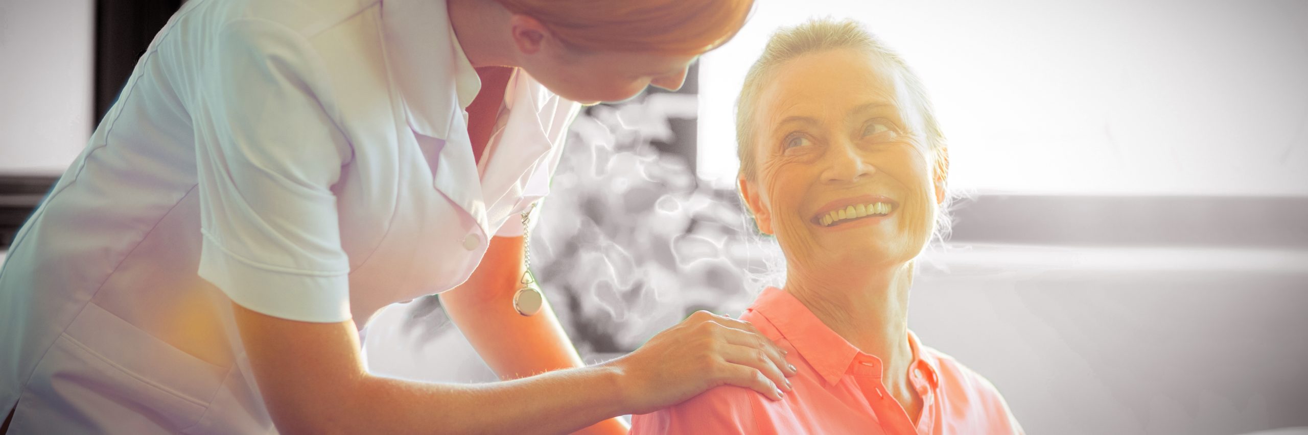 Female nurse consoling senior woman